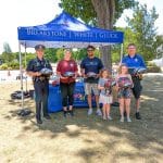 Attorney Reza Breakstone at the 2022 Dedham Bike Rodeo with Dedham Police Chief Michael D'Entremont (far left) and Officer Neil Cronin (far right) (July 27, 2022).