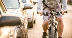 Drivers can use the Dutch Reach and reduce their chances of causing a cyclist a dooring injury. This approach calls on drivers to reach for their door with their right hand, across their body so they have a better view of the road and oncoming cyclists.